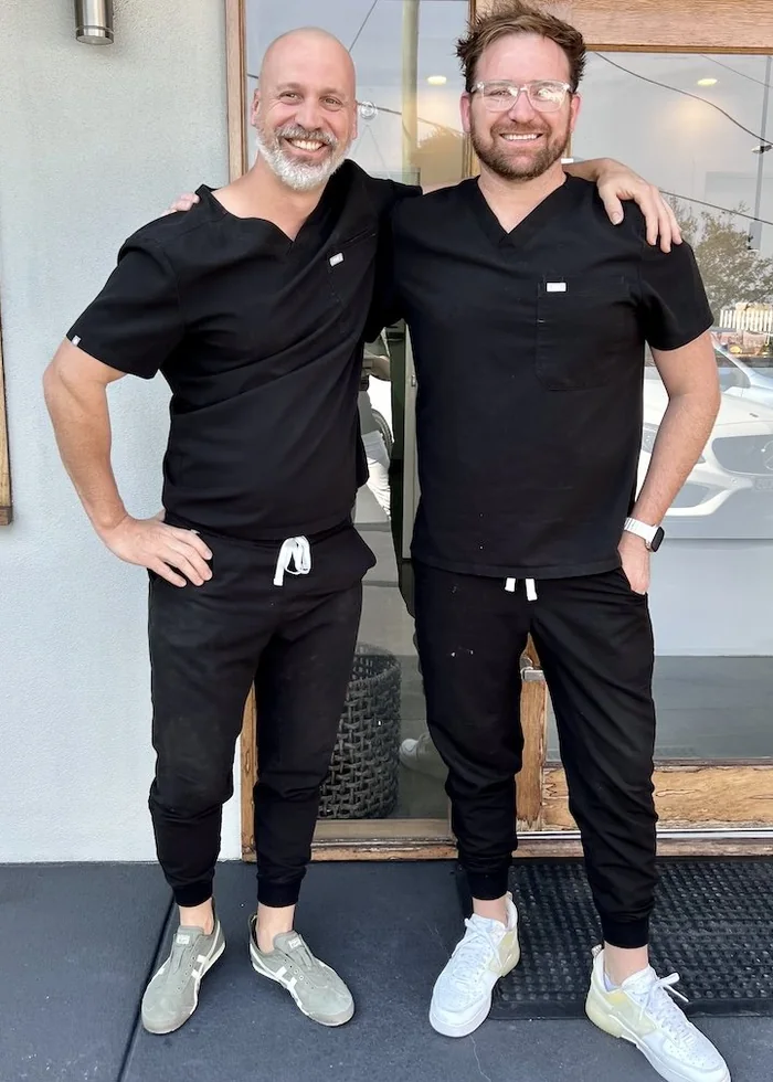 Patrik and Paul outside the DentureHaus clinic
